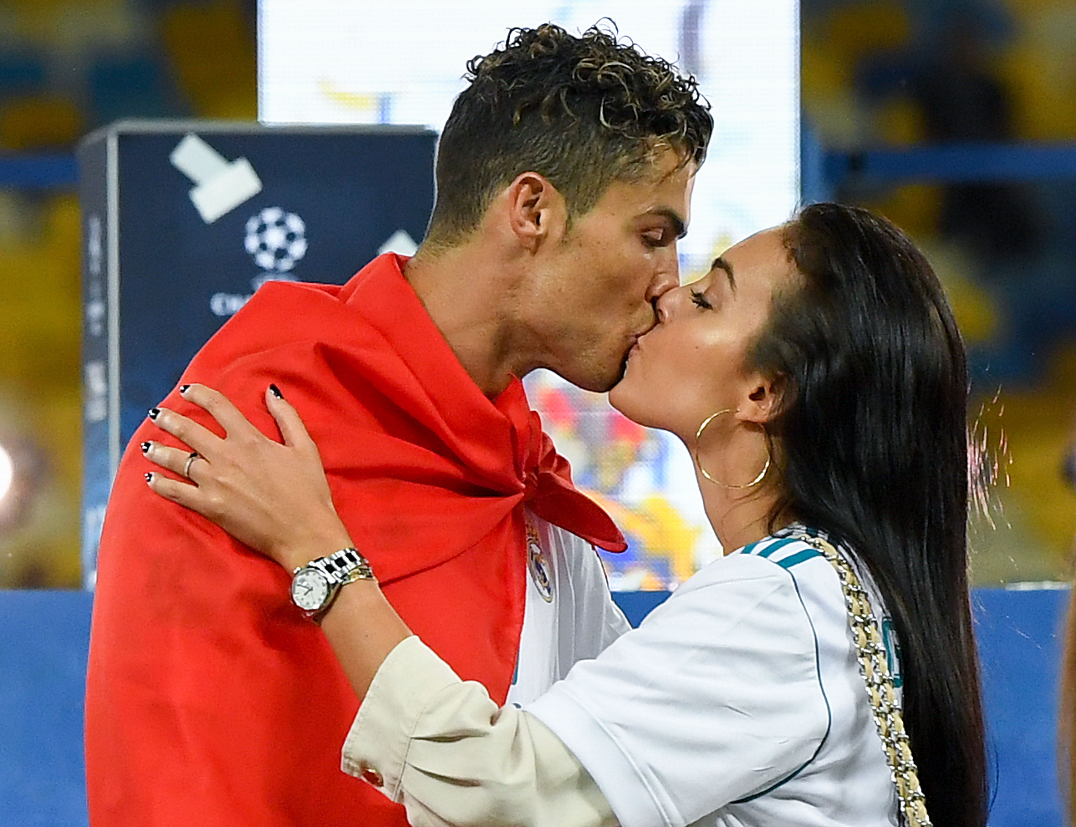 KIEV, UKRAINE - MAY 26: Cristiano Ronaldo of Real Madrid CF kisses hsi girlfriend Georgina Rodriguez as they celebrate his side victory following winning the UEFA Champions League final between Real Madrid and Liverpool on May 26, 2018 in Kiev, Ukraine. (Photo by David Ramos/Getty Images)