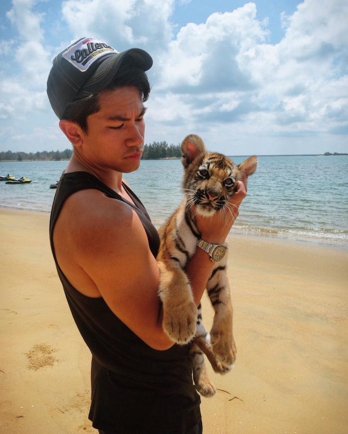 hot-prince-of-brunei-with-tiger-on-beach