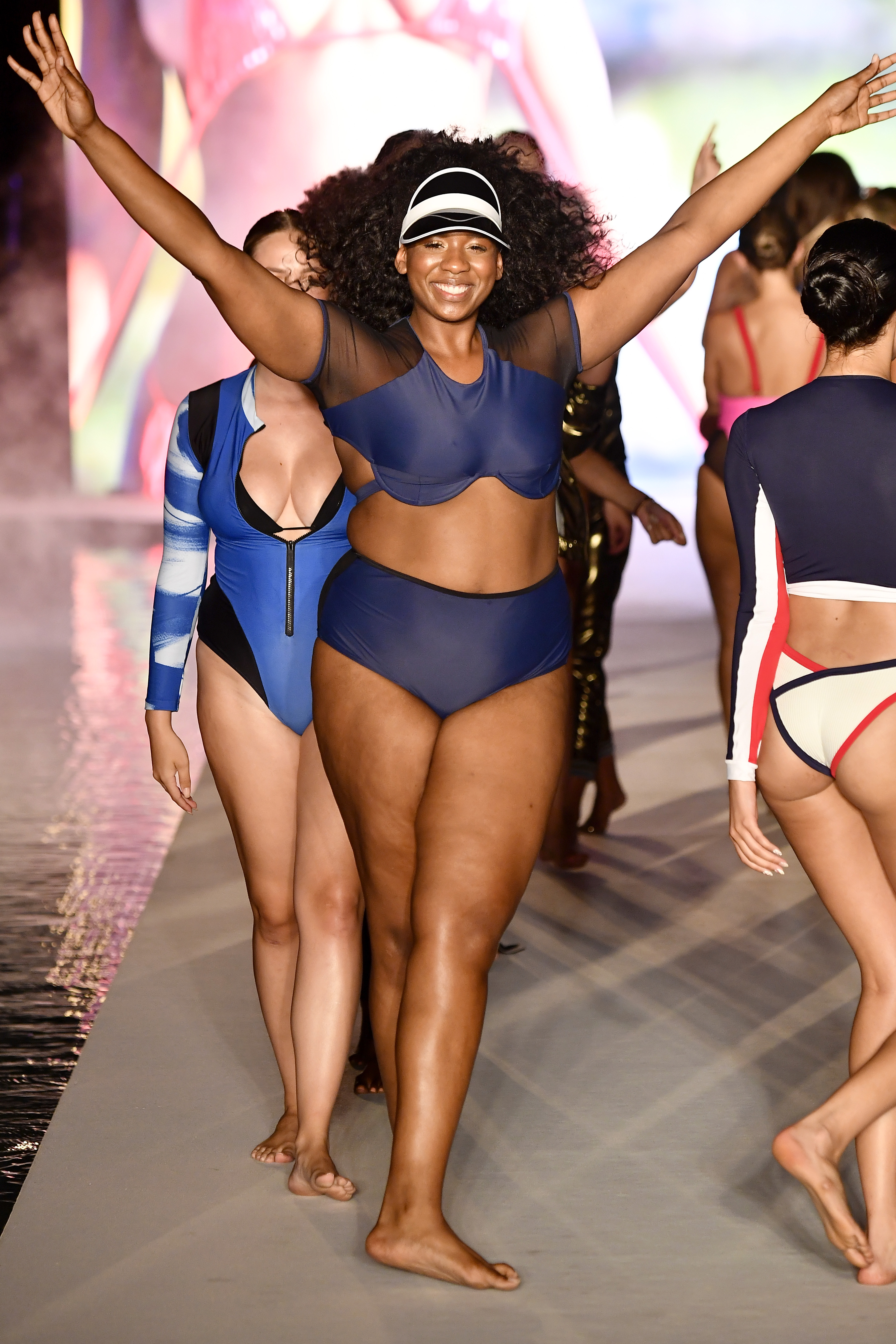 MIAMI, FL - JULY 15: Models walk the runway for the 2018 Sports Illustrated Swimsuit show at PARAISO during Miami Swim Week at The W Hotel South Beach on July 15, 2018 in Miami, Florida. (Photo by Frazer Harrison/Getty Images for Sports Illustrated)