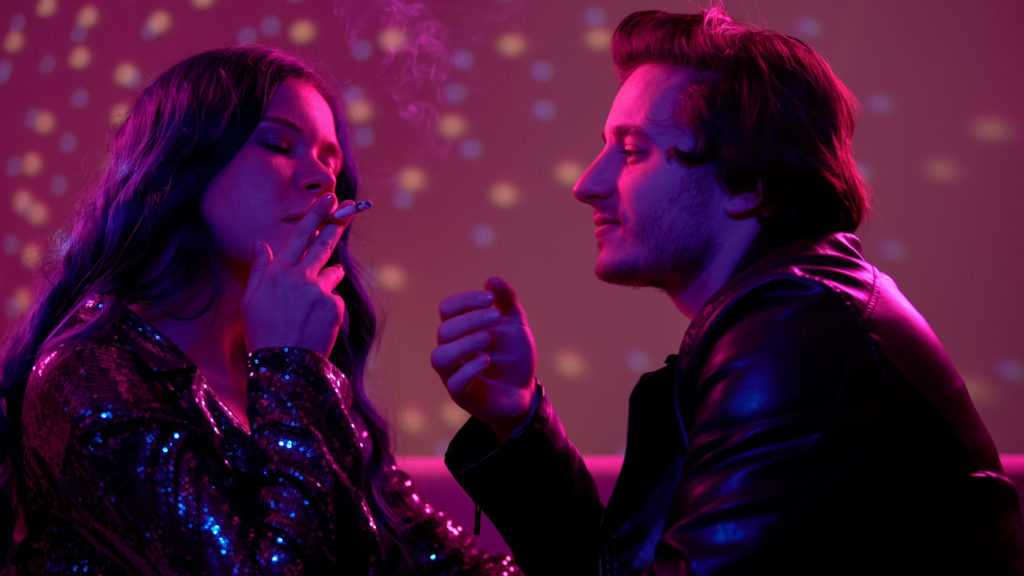 Party flirt, couple smoking cigarette together, man staring passionately at lady